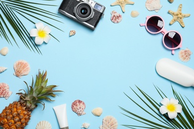 Photo of Flat lay composition with beach accessories on color background, space for text