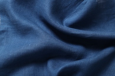 Photo of Texture of blue crumpled fabric as background, closeup