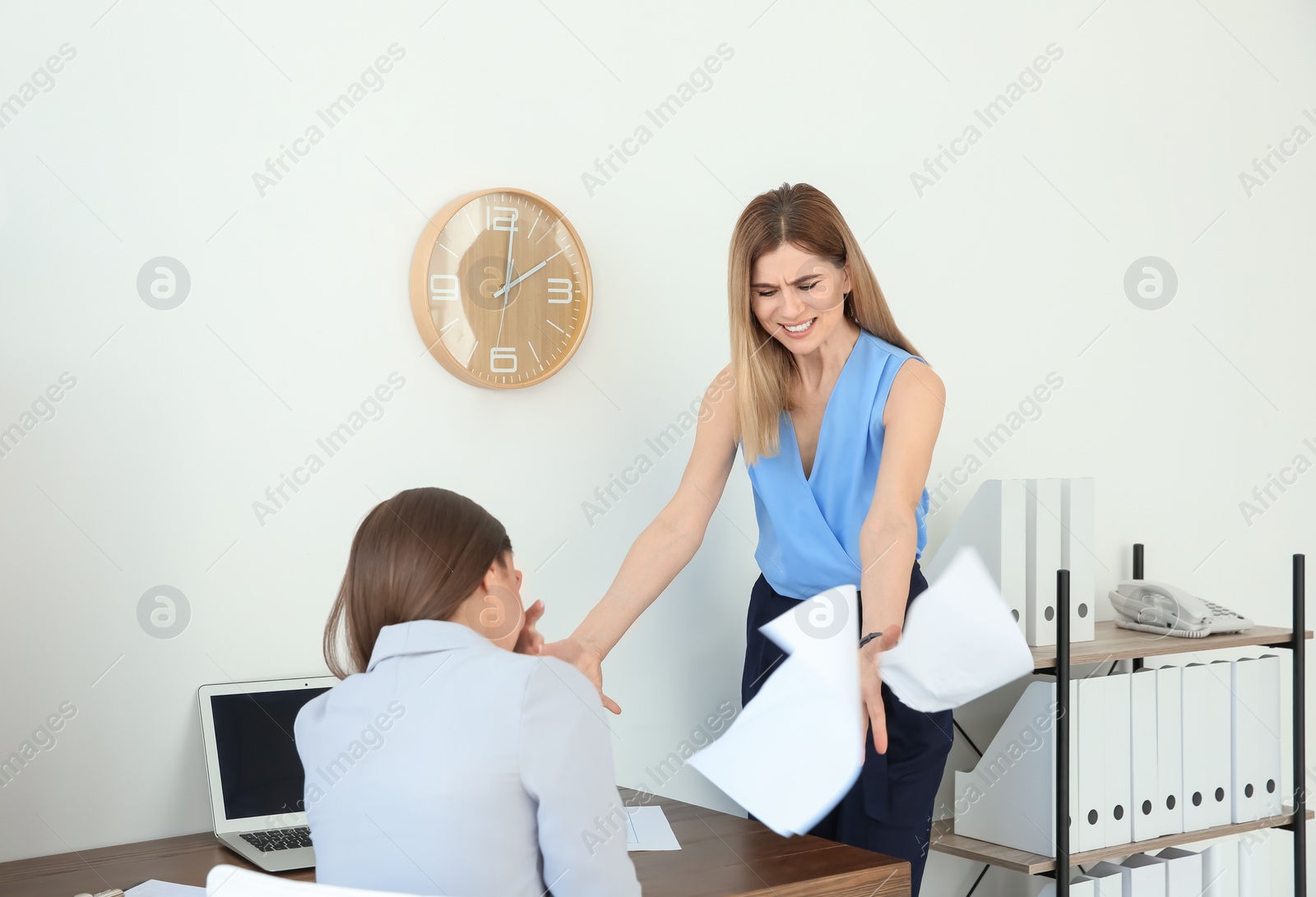 Photo of Office employees having argument at workplace