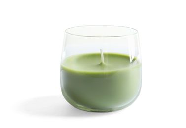 Photo of Glass with wax candle on white background