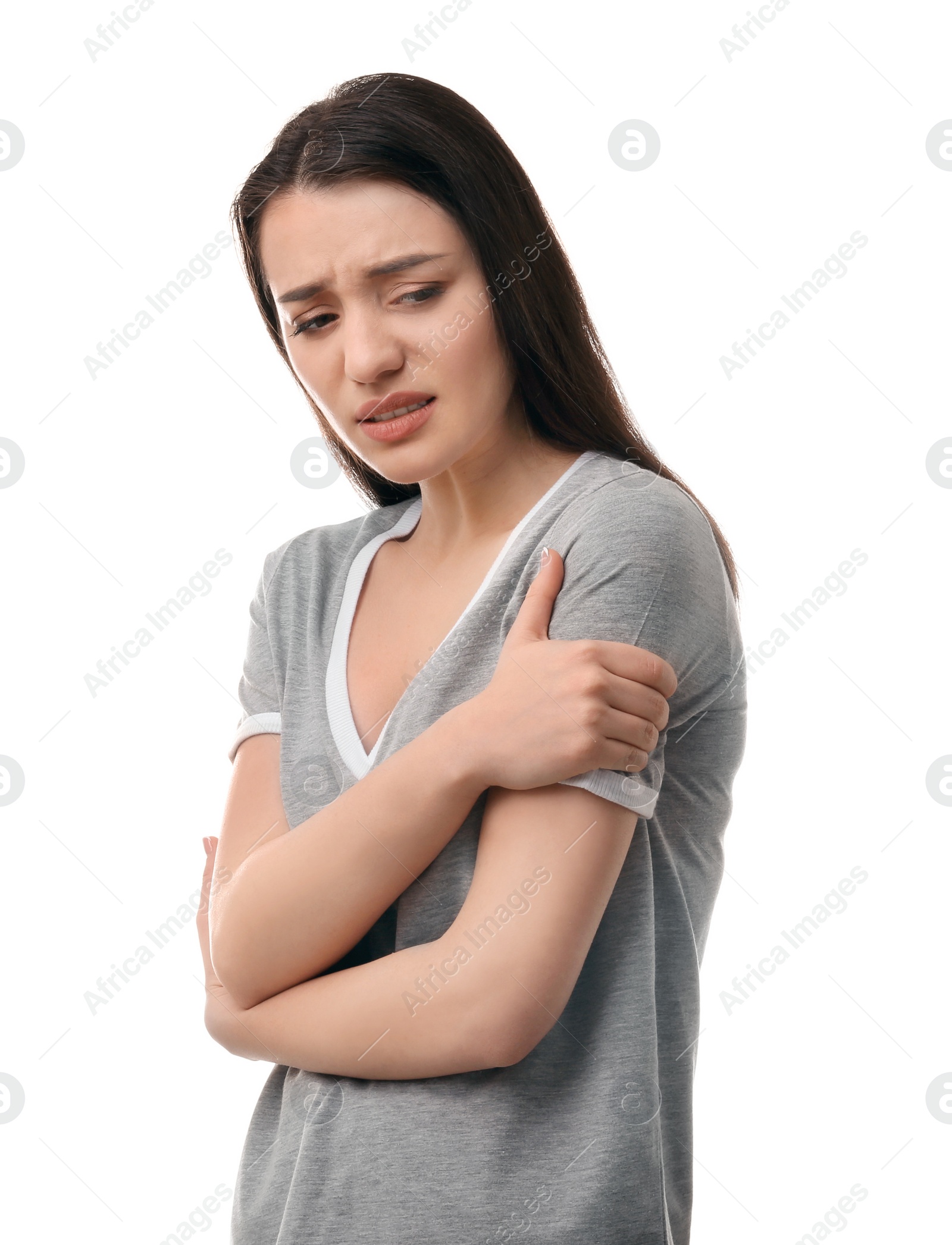 Photo of Young woman suffering from pain in shoulder on white background