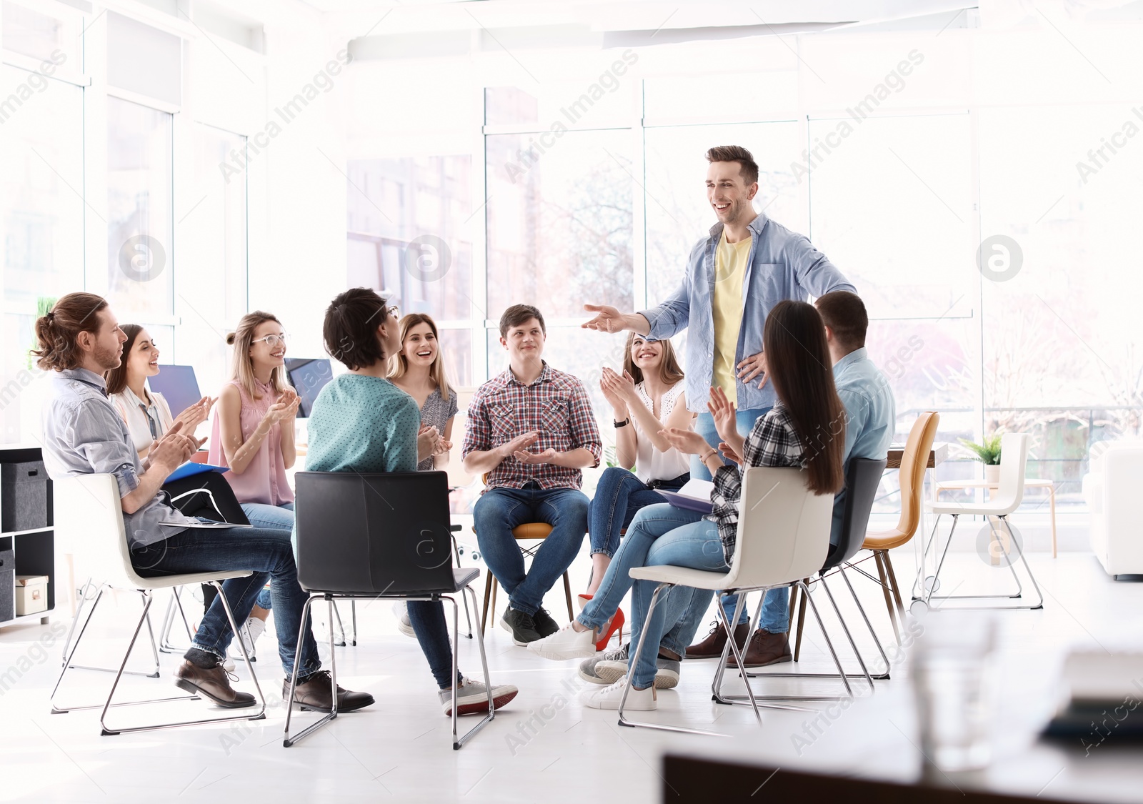 Photo of Male business trainer giving lecture in office