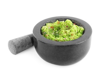 Photo of Mortar and pestle with delicious guacamole isolated on white
