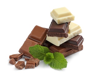 Different kinds of chocolate with mint on white background