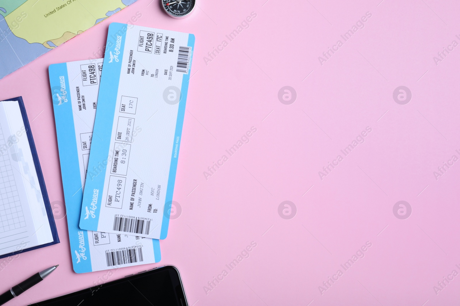 Photo of Flat lay composition with tickets on pink background, space for text. Travel agency concept