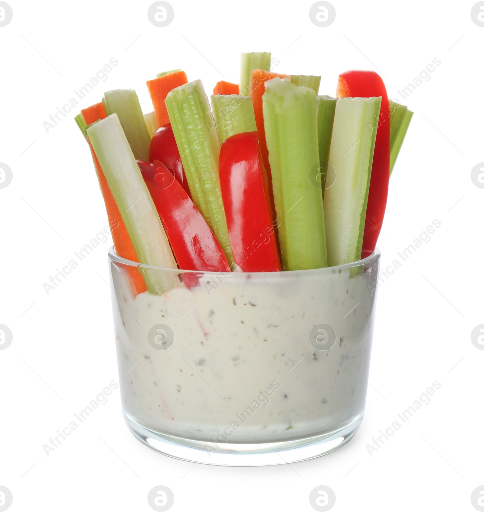 Photo of Celery and other vegetable sticks with dip sauce in glass bowl isolated on white
