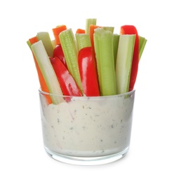 Photo of Celery and other vegetable sticks with dip sauce in glass bowl isolated on white