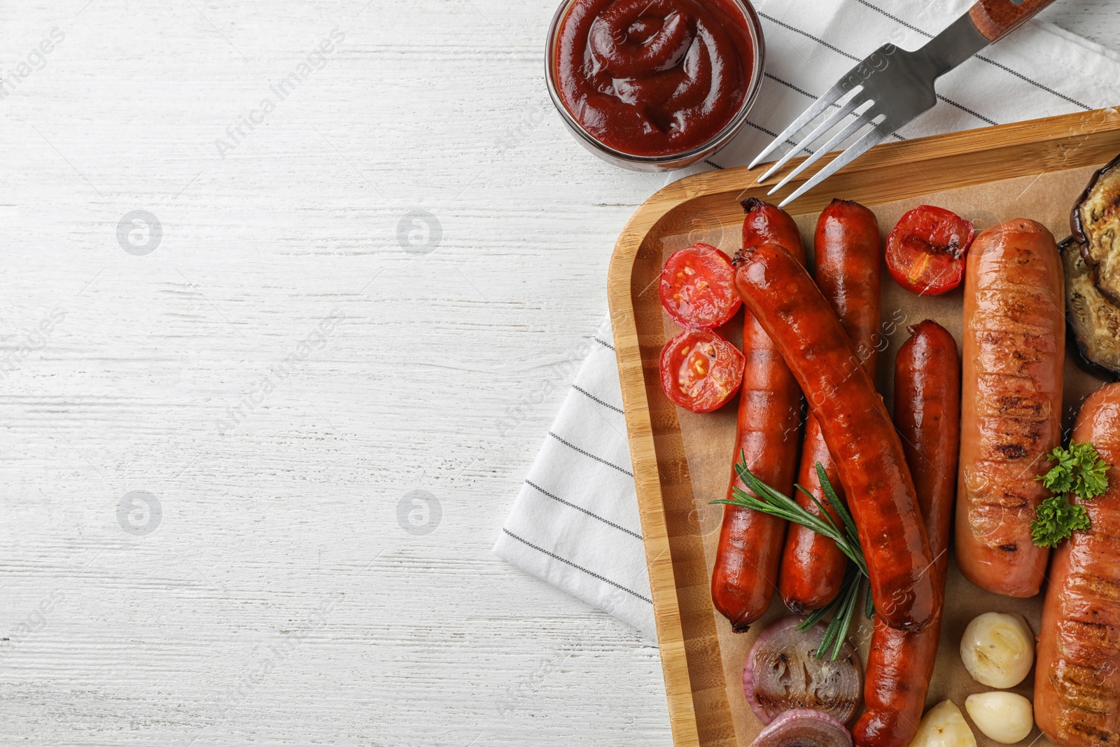 Photo of Flat lay composition with delicious grilled sausages on white wooden table, space for text. Barbecue food