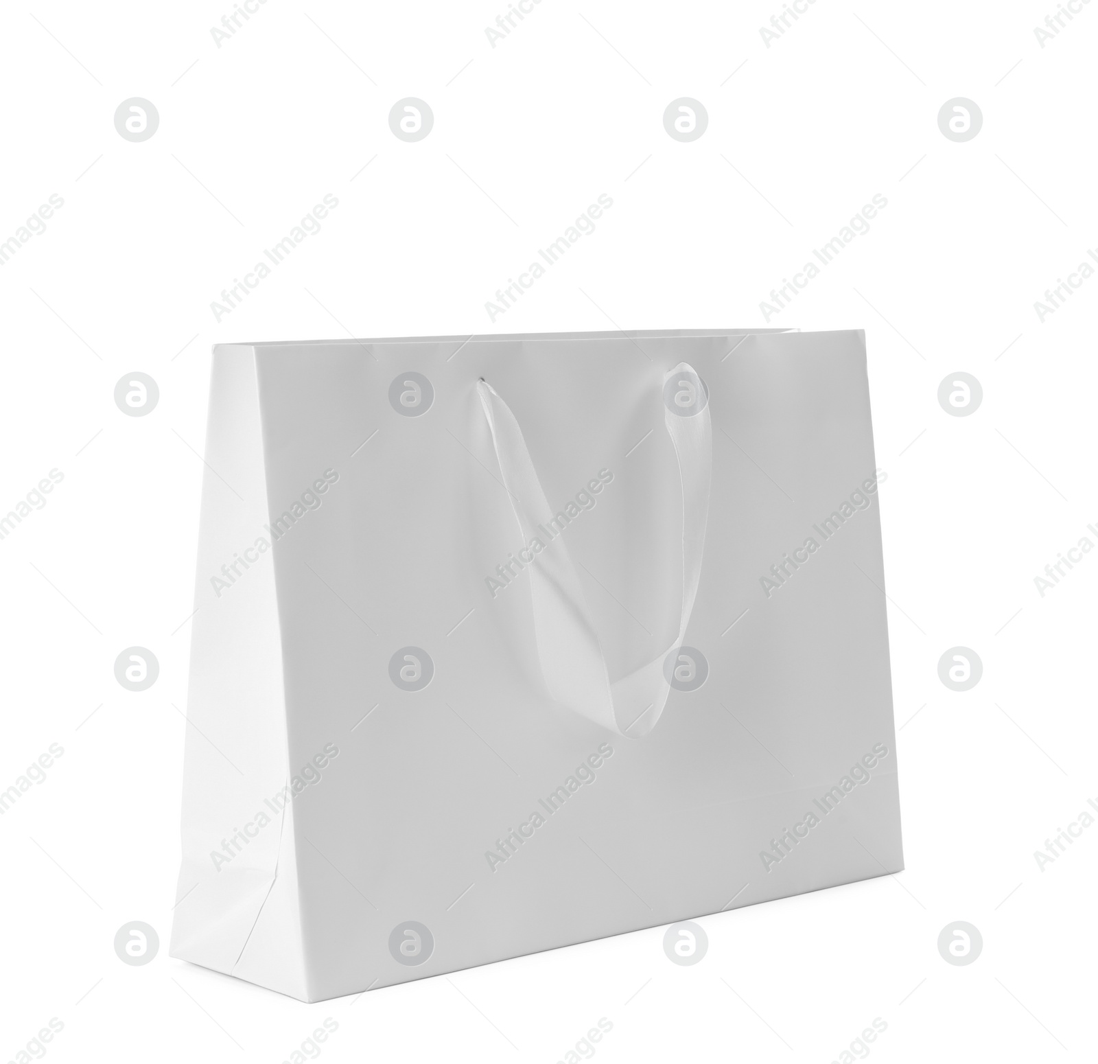 Photo of Paper shopping bag isolated on white. Mock up for design