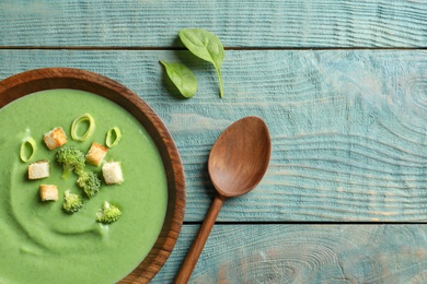 Fresh vegetable detox soup made of broccoli served on table, top view. Space for text