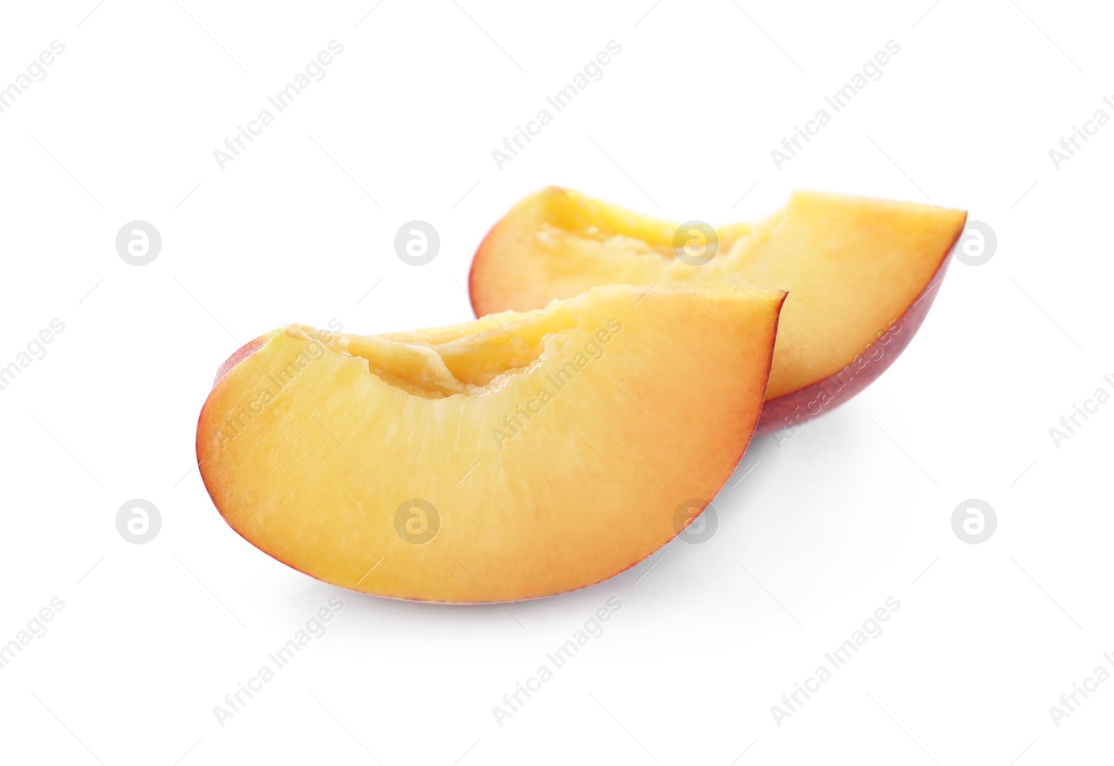 Photo of Slices of sweet juicy peach on white background