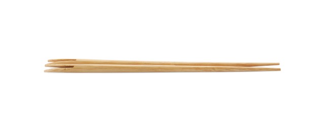 Pair of wooden chopsticks isolated on white