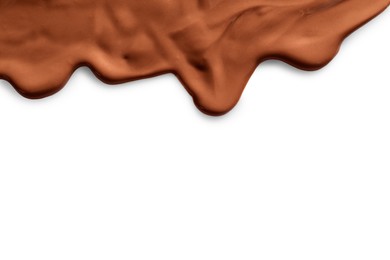 Tasty melted milk chocolate pouring down on white background