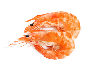 Delicious cooked shrimps isolated on white, top view