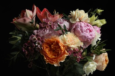 Photo of Beautiful bouquet of different flowers on black background