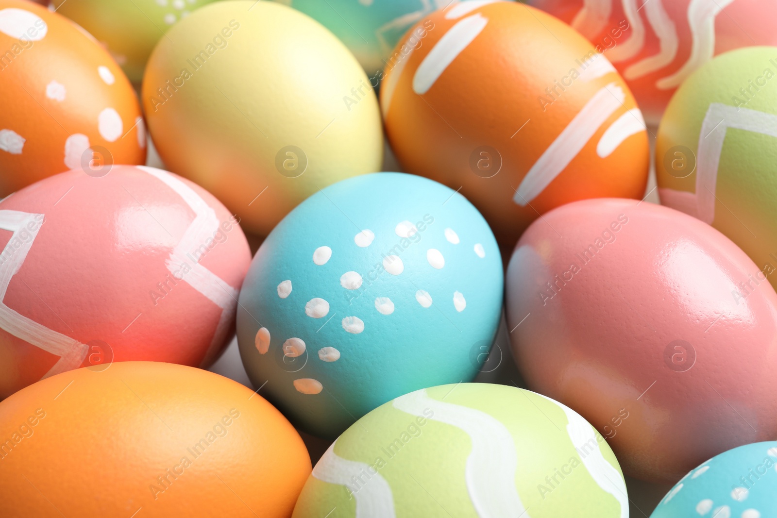 Photo of Many beautiful painted Easter eggs as background, closeup