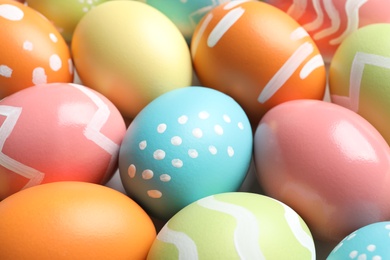 Photo of Many beautiful painted Easter eggs as background, closeup