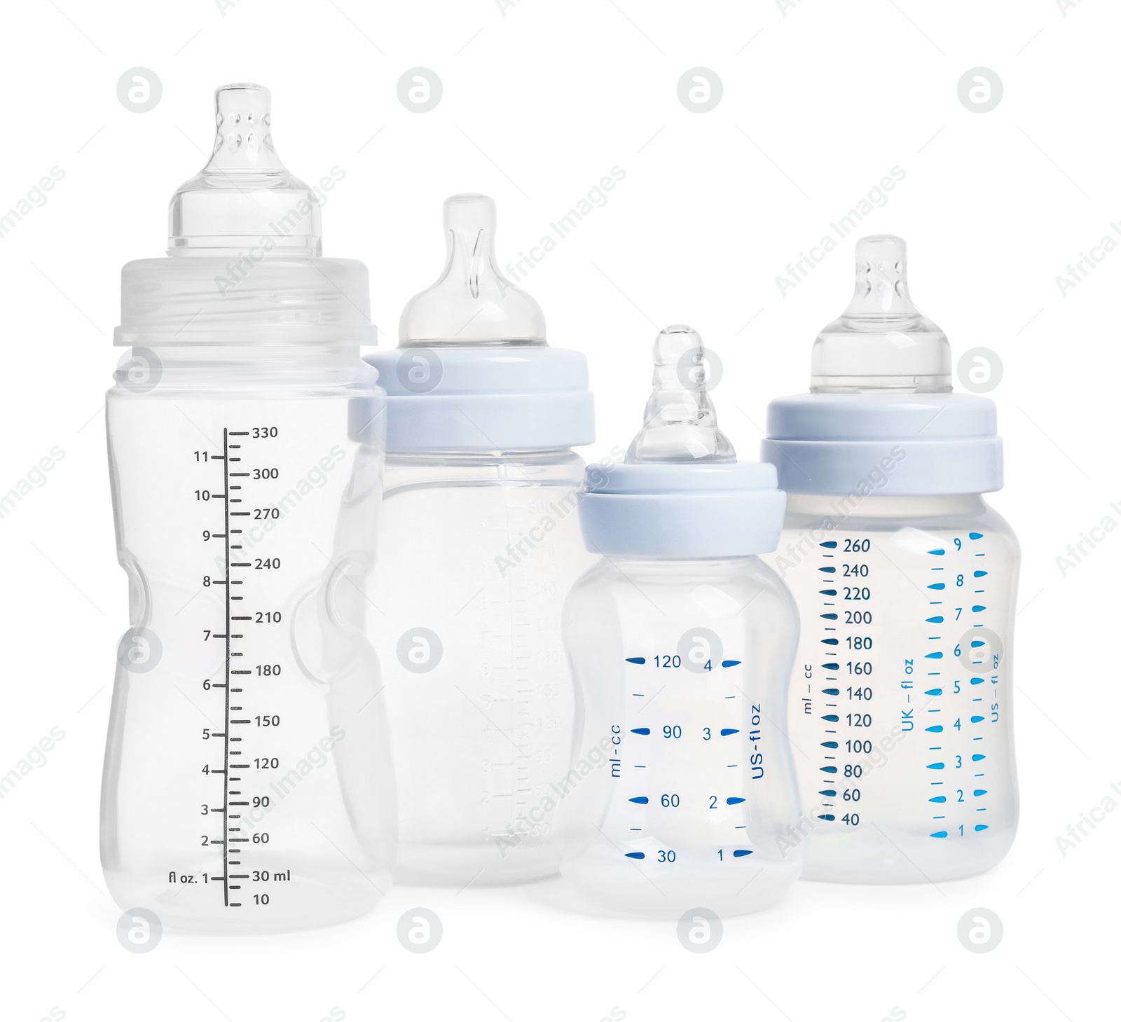 Photo of Many different empty feeding bottles for infant formula on white background