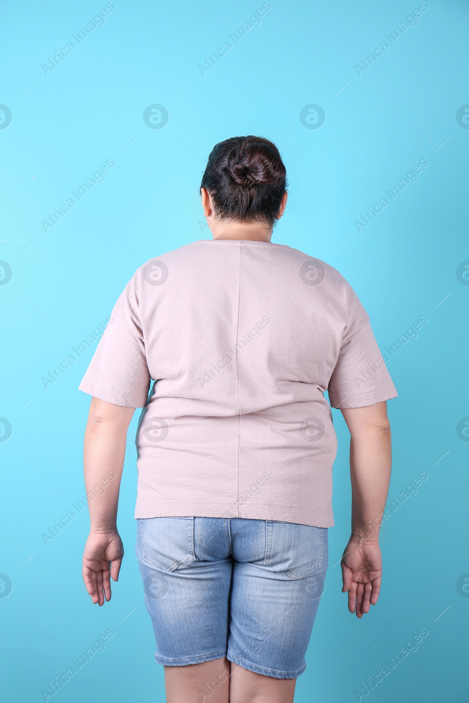 Photo of Fat woman on color background. Weight loss