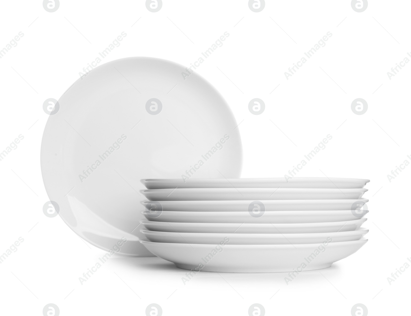 Photo of Stack of ceramic dishware on white background