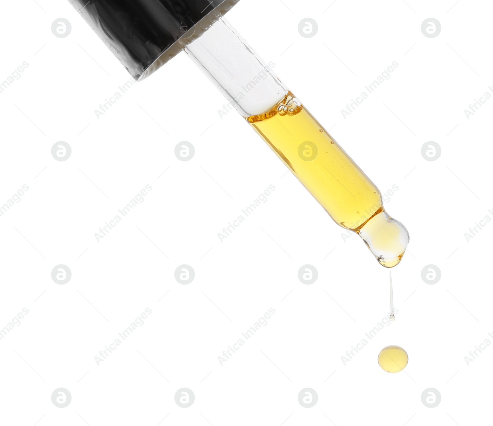 Photo of Dripping tincture from pipette isolated on white