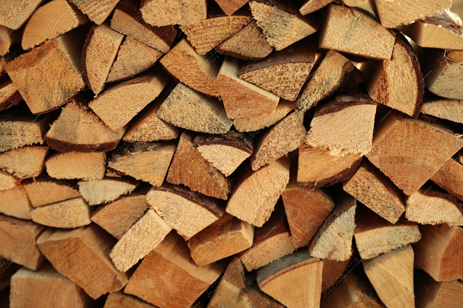 Photo of Stack of cut firewood as background, closeup