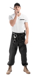 Male security guard using portable radio transmitter on white background