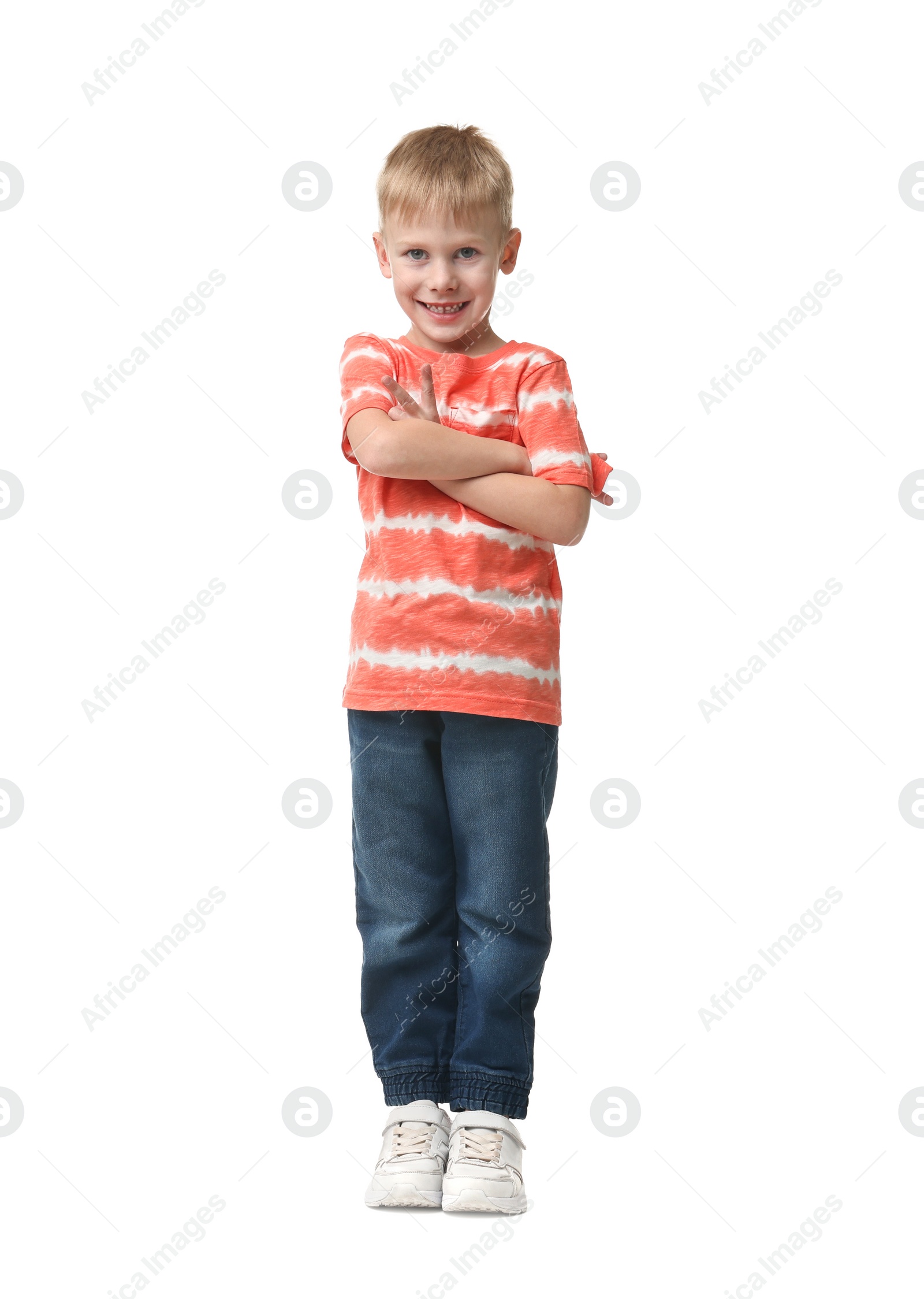 Photo of Happy little boy dancing on white background