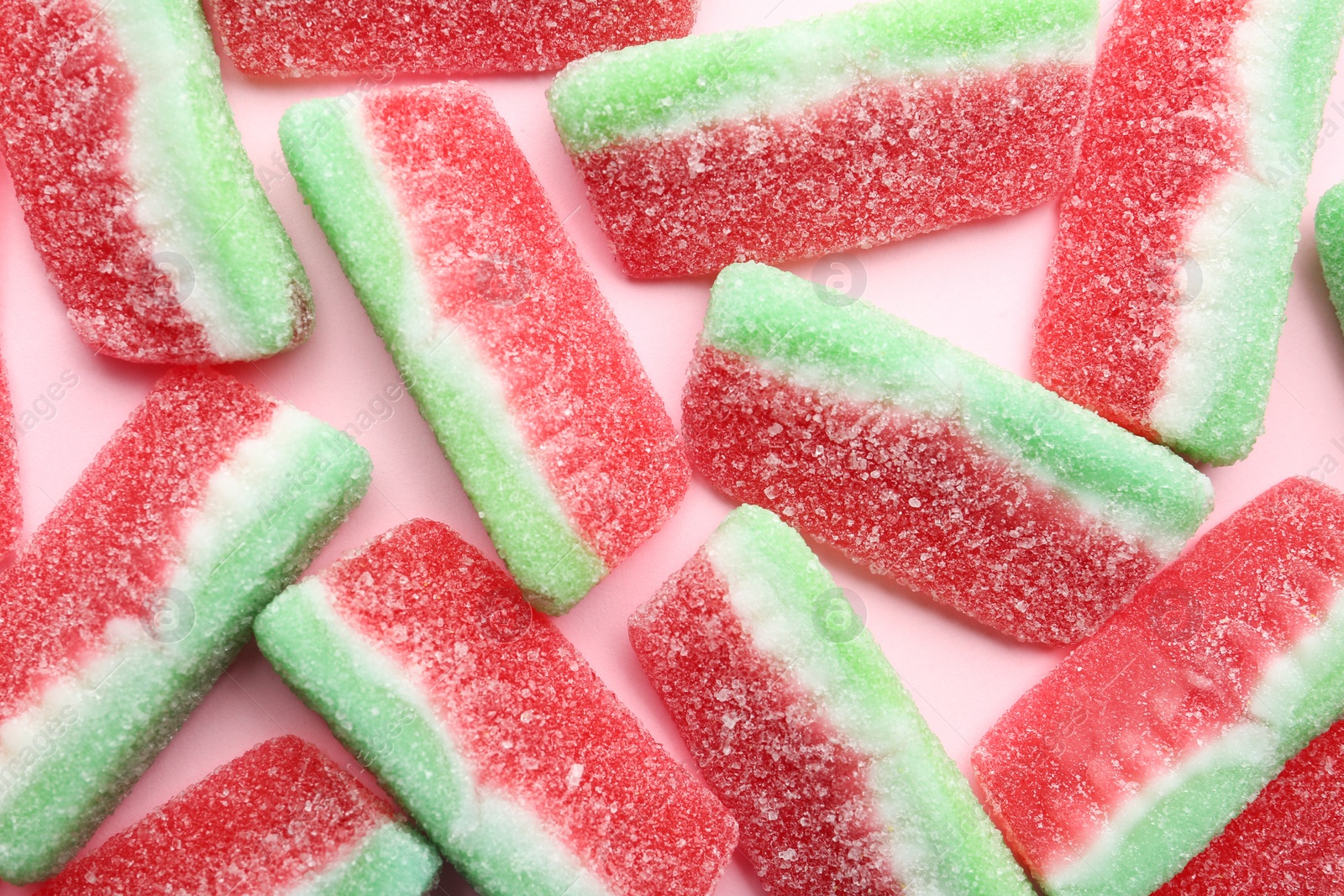 Photo of Tasty jelly candies on color background, top view