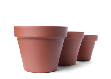 Photo of Stylish terracotta flower pots isolated on white