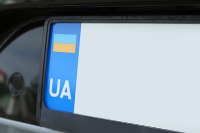 Photo of Car with vehicle registration plate, closeup view