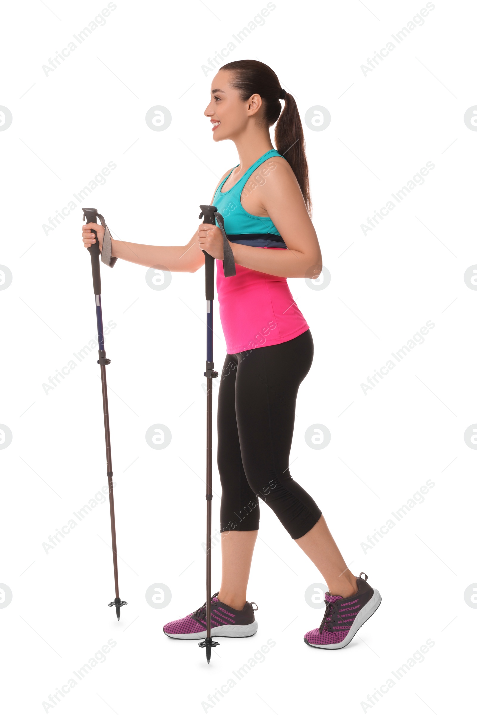 Photo of Young woman practicing Nordic walking with poles isolated on white