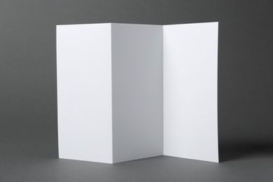 Photo of Blank brochure on gray background. Mock up for design