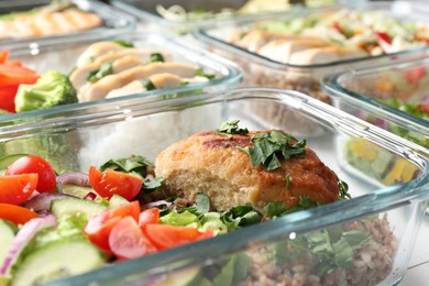 Photo of Healthy meal. Containers with different products on white wooden table, closeup