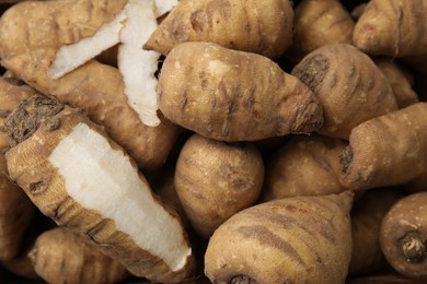 Tubers of turnip rooted chervil as background, top view