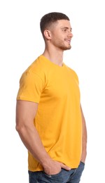 Photo of Man wearing yellow t-shirt on white background. Mockup for design