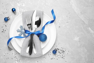 Photo of Beautiful Christmas table setting on grey background, flat lay. Space for text