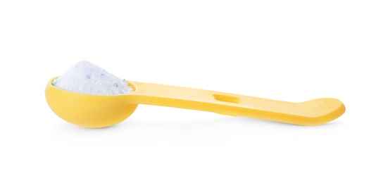 Photo of Laundry detergent in plastic measuring spoon on white background