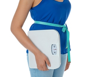 Photo of Woman with measuring tape holding scales on white background. Healthy diet