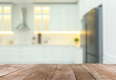 Image of Empty wooden table and blurred view of stylish kitchen interior. Mockup for design