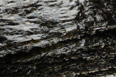 Photo of Stack of dry nori sheets as background, closeup