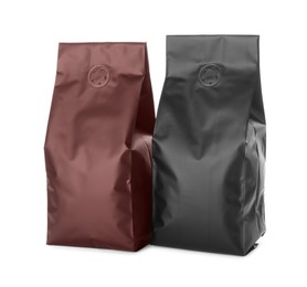 Photo of Different blank foil packages on white background