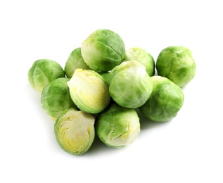 Photo of Pile of fresh Brussels sprouts isolated on white
