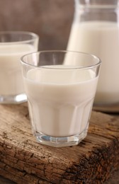 Photo of Glasses of fresh milk on table, closeup