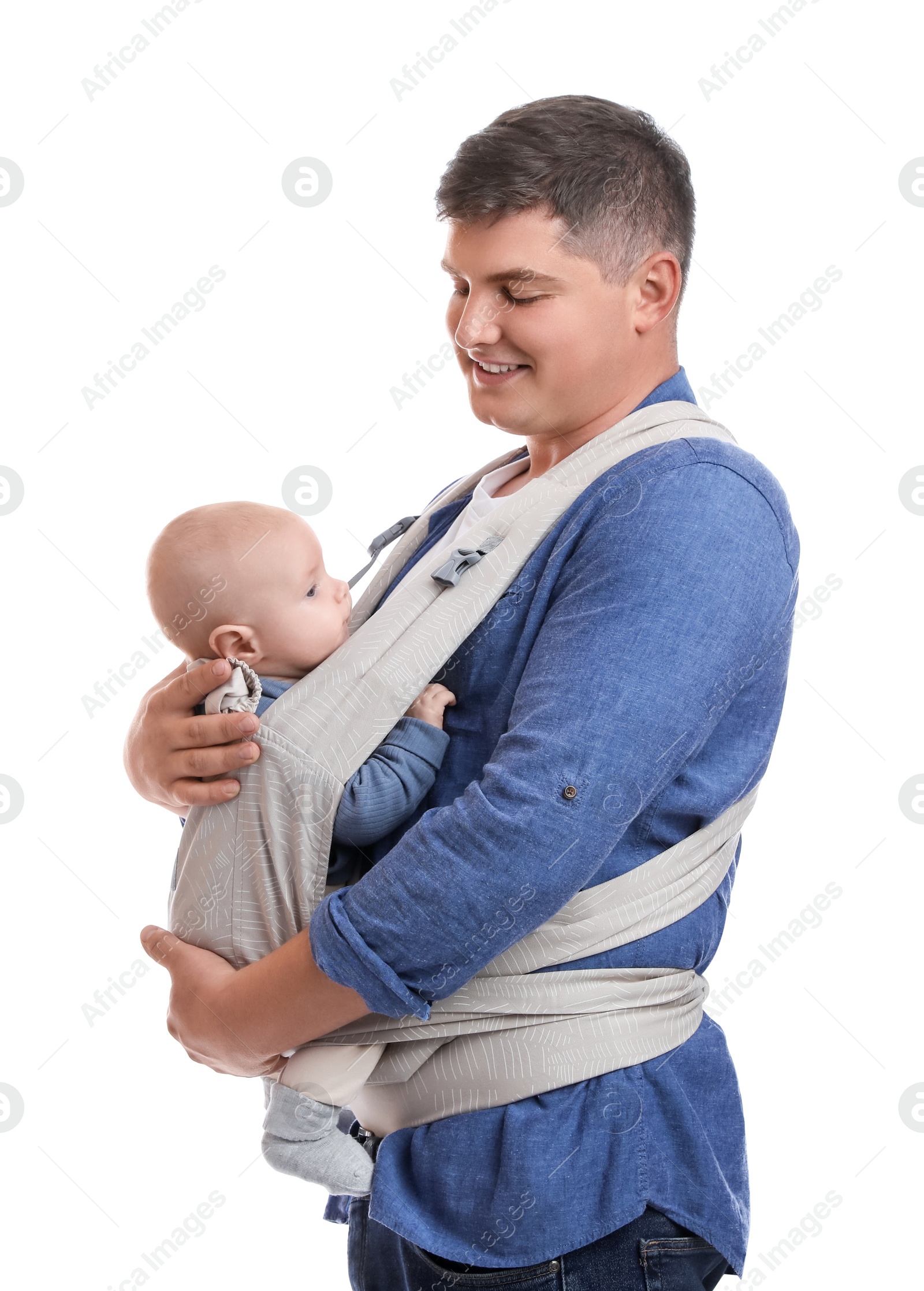 Photo of Father holding his child in baby carrier on white background