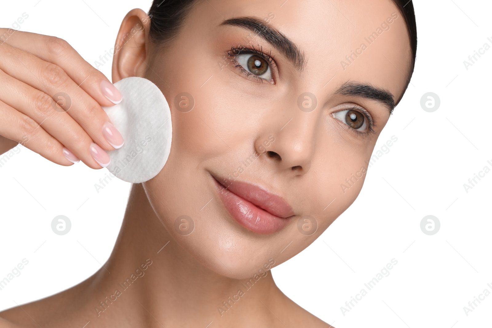 Photo of Beautiful woman removing makeup with cotton pad on white background, closeup