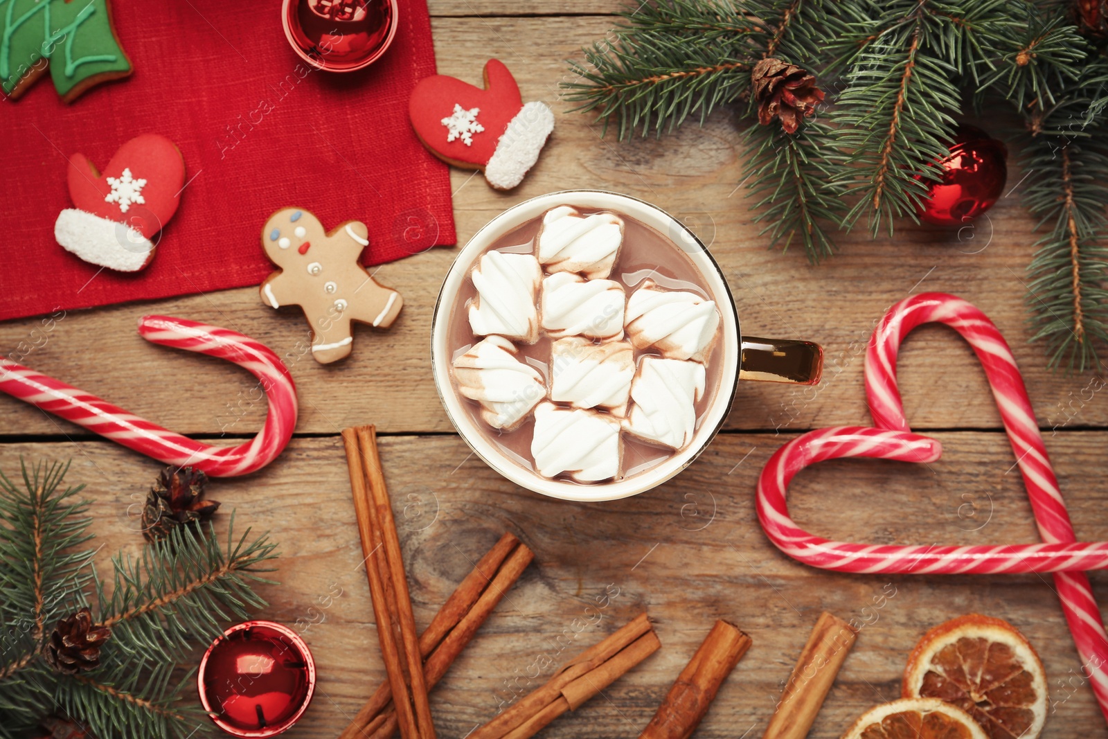 Photo of Flat lay composition of delicious hot chocolate with marshmallows and Christmas decor on wooden table