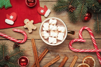 Photo of Flat lay composition of delicious hot chocolate with marshmallows and Christmas decor on wooden table