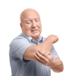 Senior man suffering from pain in elbow on white background