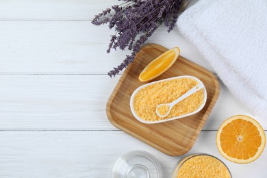 Photo of Sea salt, lavender, orange and towels on white wooden table, flat lay. Space for text